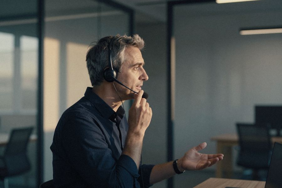 A representative transfers a caller while still on the line